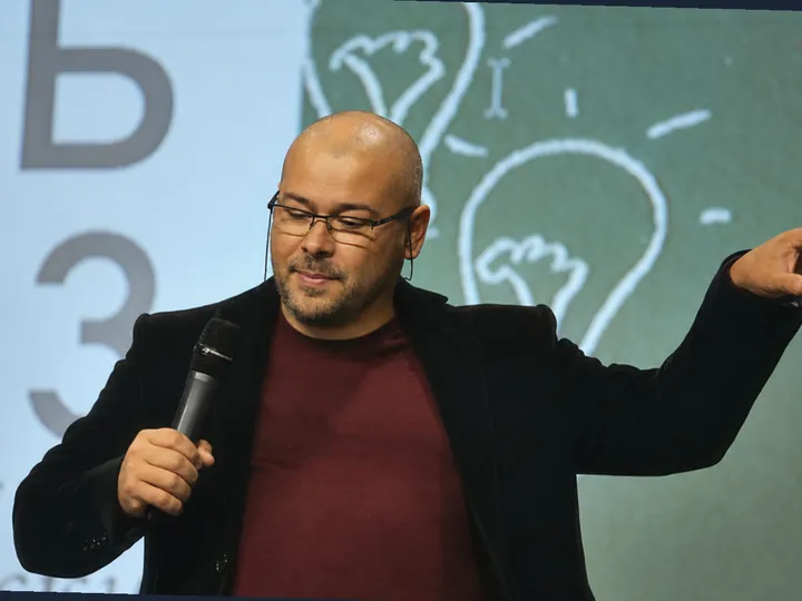 Alexey Borealis giving a talk at a conference